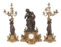 A French ThreePiece Figural Clock Garniture