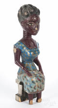 Carved and painted figure of a seated woman