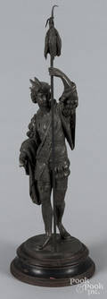 Spelter figure of a gentleman with a catch of fish
