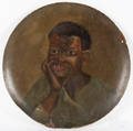Large painted ppirmache charger with a portrait of an African American boy