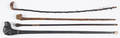 Four carved walking sticks