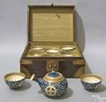 Oriental tea set to include blue glaze and gilt decorated teapot with 5 cups within a wood and brass bound box