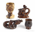 Two Rockingham figural mugs
