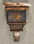 Tin downspout with a star