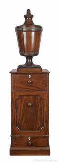 Centennial mahogany urn on a cabinet base