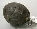 Handcarved coconut shell canteen with relief decoration of a soldier