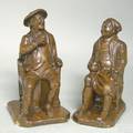 Two redware figures of a seated gentleman mid 19th c