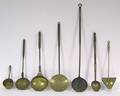 Five wrought iron brass and copper skimmers early 19th c