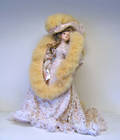 Porcelain doll with elaborate dress