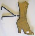 Wood and brass shoe form trade sign