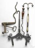 Group of wrought iron fireplace implements 19th c
