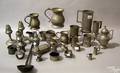 Large group of pewter tableware to include measures