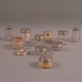Ten Sterling Silver and Silverplatelidded Glass Dresser Jars