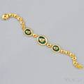 18kt Gold Enamel and Garnet Bracelet