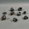 Nine Mostly American Victorian Figural Silverplate Napkin Rings