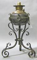 Large ornamental iron and brass fluid lamp marked Miller