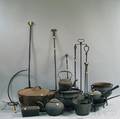 Approximately Seventeen Cast Iron Pots Accessories and Wrought Iron Tools