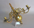 Brass chandelier with 6 arms radiating from a ball shaft