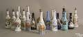 Nineteen barber bottles to include 11 white milk glass with various decorations