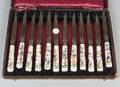 Set of Twelve Chinoiserie Decorated Porcelain Handled Knives
