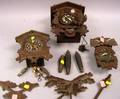 Three Carved Wood Cuckoo Clocks