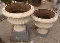 Pair of Creme and Gray Painted Cast Iron Garden Urns on Plinths