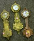 Three Gilt Cast Metal Novelty Banjo Clocks