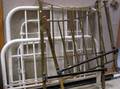Two Painted Cast Iron Beds and a Brass Bed