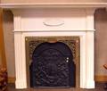 Georgianstyle White Painted Fireplace Surround a Cast Iron Heraldic Fireback and a Victorian Brass Foliate Fireplace Surround