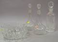 Three Colorless Glass Decanters and a Bowl