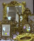 Eight Assorted Gilt Cast Brass and Metal Table Frames and a Mirrored Sconce