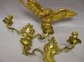 Small Carved Giltwood Eagle and a Pair of Rococostyle Gilt Cast Brass TwoArm Wall Sconces