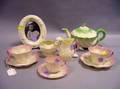 Nine Pieces of Belleek Porcelain Teaware and a Belleek Oval Table Frame