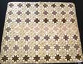 Quaker pieced quilt in a muted star pattern