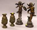 Pair of Patinated Cast Metal Winged Figures and a Pair of Patinated Cast Metal Cherub Decorated Vases