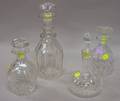 Four Small Colorless Cut Leaded Glass Decanters