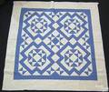 Blue and white pieced quilt dated 1929