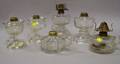 Six Colorless Pressed Glass Hand Lamps