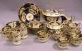 Thirtyfour Piece English Gilt and Handpainted Floral Decorated Porcelain Partial Tea Set