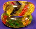 Two Bakelite Reverse Carved and Painted Bangles