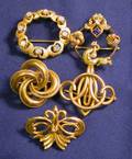 Five 14kt Gold and Gemset Brooches