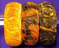 Set of Three Bakelite End of Day Carved Bangles