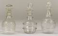 Three Blown Molded Colorless Glass Decanters