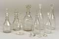 Eight Blown Colorless Glass Decanters