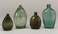 Four Colored Blown Molded Glass Flasks
