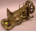 The Singer Manufacturing Co Gilt Decorated and MotherofPearl Inlaid Cast Iron Sewing Machine