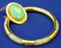 Jade Bangle and a Gold and Gemstone Pin