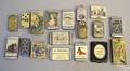 Thirteen mixed metal and lithographed advertising match safes