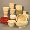 Ten Pieces of White Glazed Art Pottery and Two Colored Glazed Art Pottery Planters