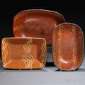 Three Slipdecorated Redware Loaf Dishes